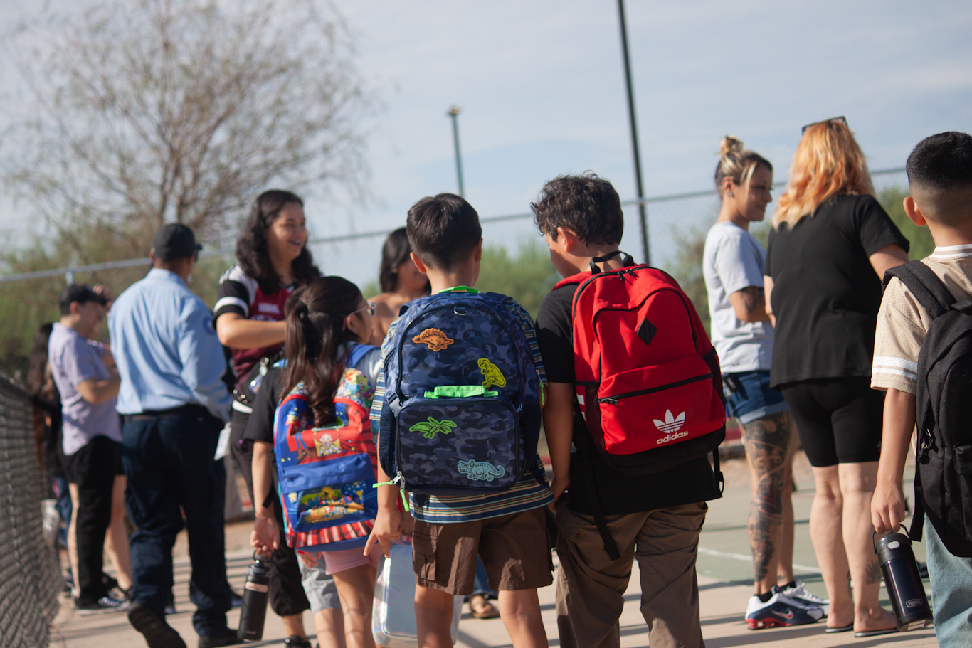 Students gather outside before school starts